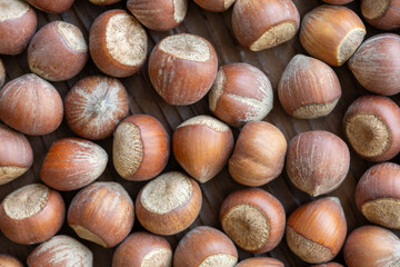 hazelnuts on wooden background macro shot