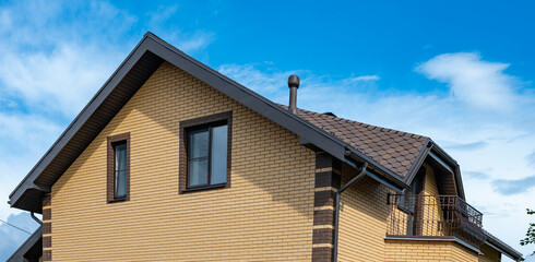 Elegant House with Modern Roof Tiles and Chimney View
