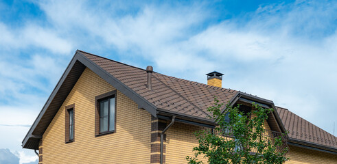 Elegant House with Modern Roof Tiles and Chimney View