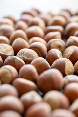 hazelnuts on wooden background macro shot