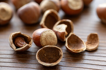hazelnuts on wooden background macro shot