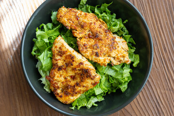 fried chicken with salad vegetables close up