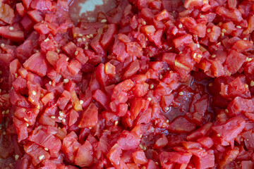 Grated tomatoes being prepared for winter storage in jars