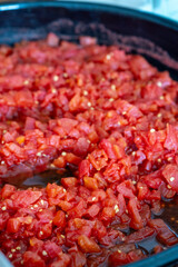 Grated tomatoes being prepared for winter storage in jars
