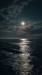 Fototapeta premium Night seascape, moon reflecting on ocean waves, stars pierce through scattered clouds