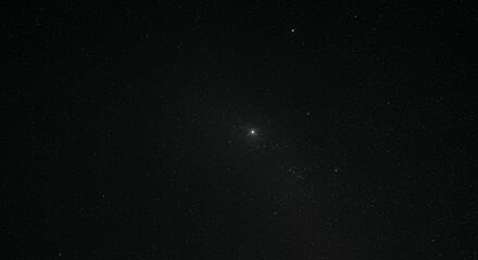 Distant bright star or galaxy surrounded by countless stars in deep dark space minimalist astronomy background