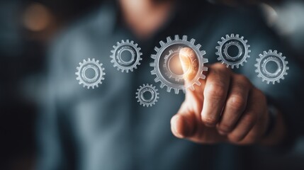 Fototapeta premium Hand interacting with gears