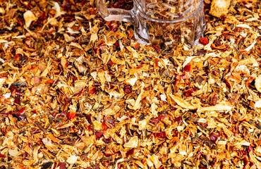 Vibrant assortment of dried spices displayed in a market setting showcasing rich textures and colors during a sunny afternoon