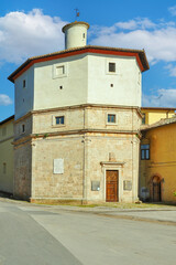The Church of Santa Maria della Pace in Massa Martana, Umbria, Italy, built in the late Renaissance style in the 16th century, photographed  under a bright blue sky.