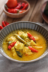 Ayam garang asem. Chicken with sour and spicy soup. perfect for recipe, article, or any commercial purposes.