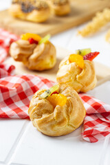 Eclair choux pastry on a white table. perfect for recipe, article, or any commercial purposes.