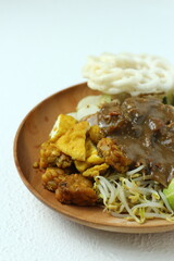 Rujak cingur. javanese vegetable salad with rice cake and cow mouth. with peanut sauce.