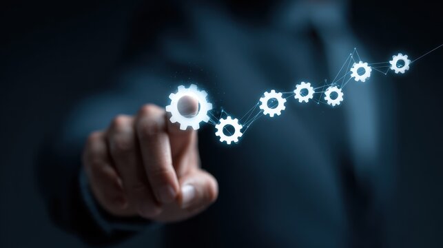 Hand pointing to interconnected gears for workflow
