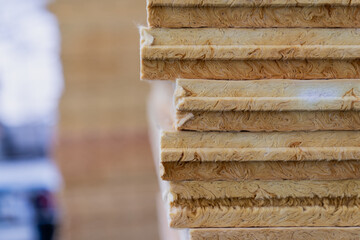 nsulation panels stacked fiberglass sheets thermal protection building renovation material construction housing energy saving efficiency industrial architecture infrastructure detail closeup