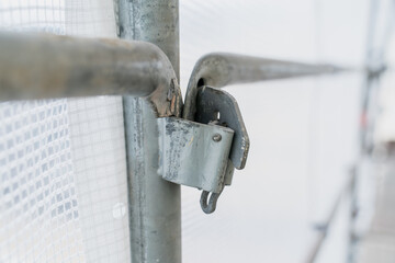 Metal scaffold joint with locking clamp fastening construction framework detail safety connection