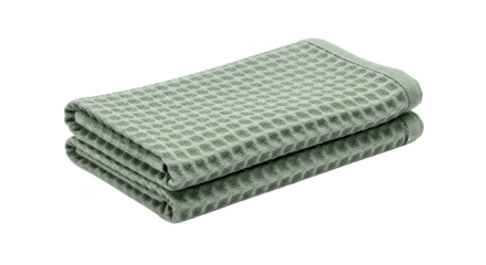 Soft pastel green waffle weave towels folded neatly on a clean white background, perfect for home decor
