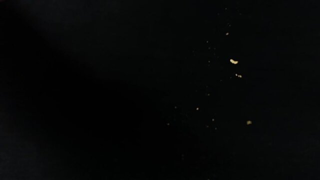 kintsugi gold cracks restoration process, Japanese black bowl fixed with the antique kintsukuroi restoration technique, the beauty of imperfections, representation of a trauma