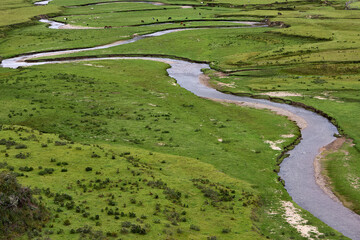 Vast and breathtaking, the Huaylla Belén Valley in Amazonas, Peru unfolds in gentle curves of grassland and water—where the Andes and sky meet in quiet harmony.