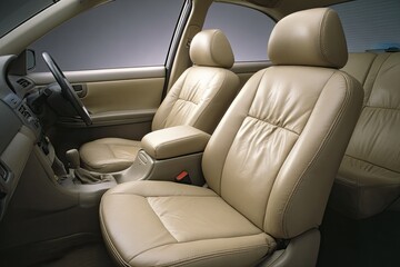 Fototapeta premium Beige leather car interior, showing seats and dashboard
