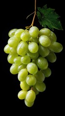 green grape bunch on black background, fresh fruit, studio lighting.