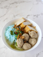 Bakso. A bowl of Indonesian meatball with noodle and tofu.