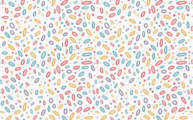 A playful and vibrant seamless pattern featuring scattered colorful oval shapes and small dots on a clean white background