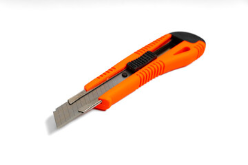 Side view of red utility knife isolated on white background. Closeup professional red office paper knife isolated on white background.