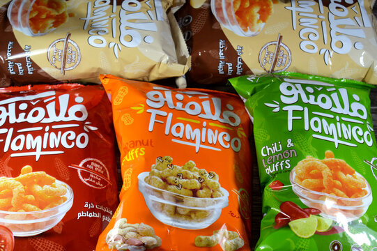 Cairo, Egypt, August 11 2025: Assorted flavors Flaminco smoked Cheese, peanut, chili lemon, zesty tomato flavor Puffcorn or corn puffs are puffed or extruded corn snacks made with corn meal