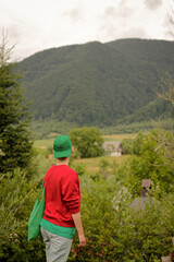 Naklejka premium young man walking in the mountains