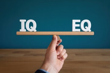 Hand Balancing "IQ" and "EQ" on Seesaw, emotional and cognitive intelligence, business balance.