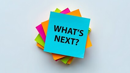 Stack of colorful sticky notes with what's next question on top