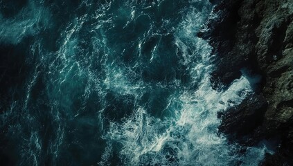 Dark, turbulent ocean waves crashing against rocks