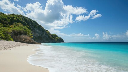 Obraz premium A secluded beach with soft white sand and lush greenery surrounding the shoreline, offering a serene atmosphere.