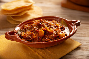 Ground beef tinga, a traditional Mexican home-cooked dish consisting primarily of beef cooked with chipotle chili and lots of onion, is traditionally eaten on 