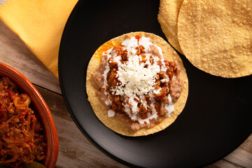 Ground beef tinga, a traditional Mexican home-cooked dish consisting primarily of beef cooked with chipotle chili and lots of onion, is traditionally eaten on 