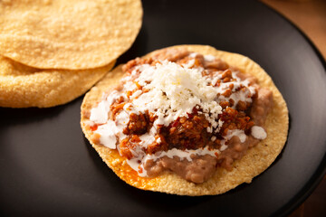 Ground beef tinga, a traditional Mexican home-cooked dish consisting primarily of beef cooked with chipotle chili and lots of onion, is traditionally eaten on 