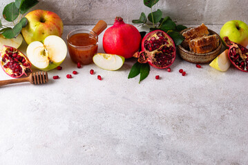 Rosh Hashana concept with honey, apple and pomegranate