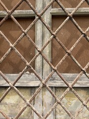 Rusty bars in front of a window 