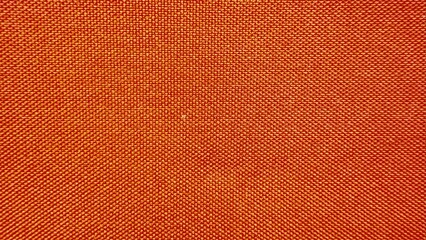 Obraz premium vibrant orange and gold woven textile close up with fine crosshatch texture ideal for upholstery or craft design projects