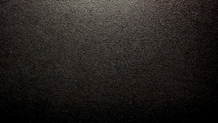 closeup of dark textured metallic surface with fine grain pattern for industrial background or luxury product design mockup