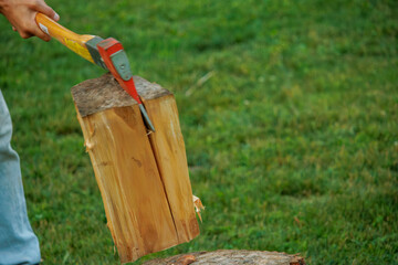 splitting firewood with an axe