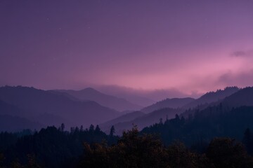 Dreamlike Layered Mountain Silhouettes at Twilight in Digital Painting Style