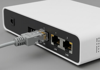 A close up of a white router with a gray ethernet cable plugged in on a gray surface in a studio setting