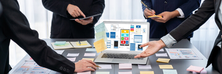 Analyst team use sticky note for creative and analytic brainstorm for business idea with BI data dashboard on laptop screen. Analysis financial data visualization tech for marketing strategy. Prodigy