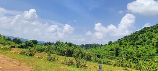 Obraz premium landscape view of mountain and field under sky