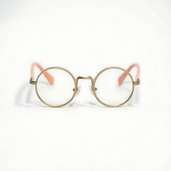 Round eyeglasses with gold frames isolated on white background