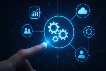 Fototapeta premium Finger touching glowing blue digital interface with interconnected icons representing business processes and automation