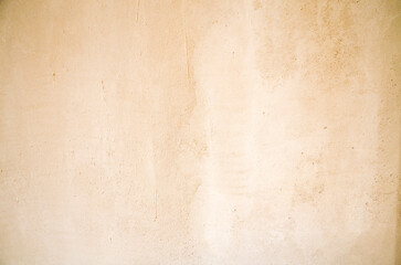 Detailed view of a beige textured surface with subtle irregularities, ideal for use as a backdrop or abstract pattern in design and art projects