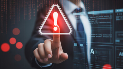 Cybersecurity Alert A Man Points to a Warning Sign Indicating a Potential Threat to Data and Systems