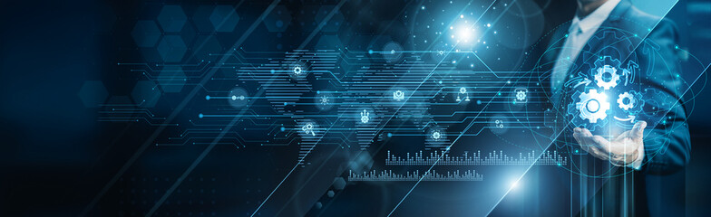 Businessman holding building of automation solutions, workflow optimization, robotics, AI...